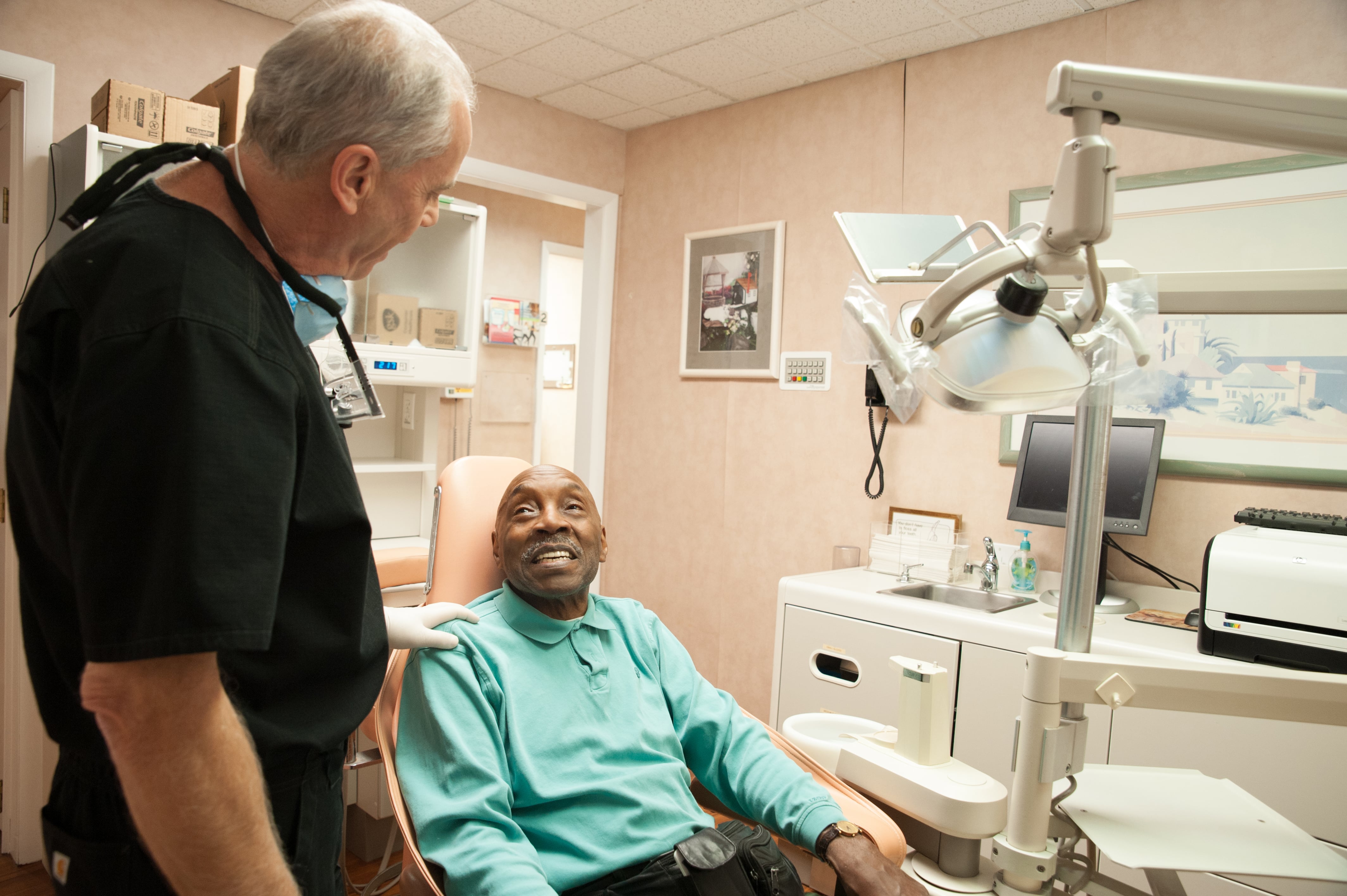 Dr. Thurm with patient in chair photo