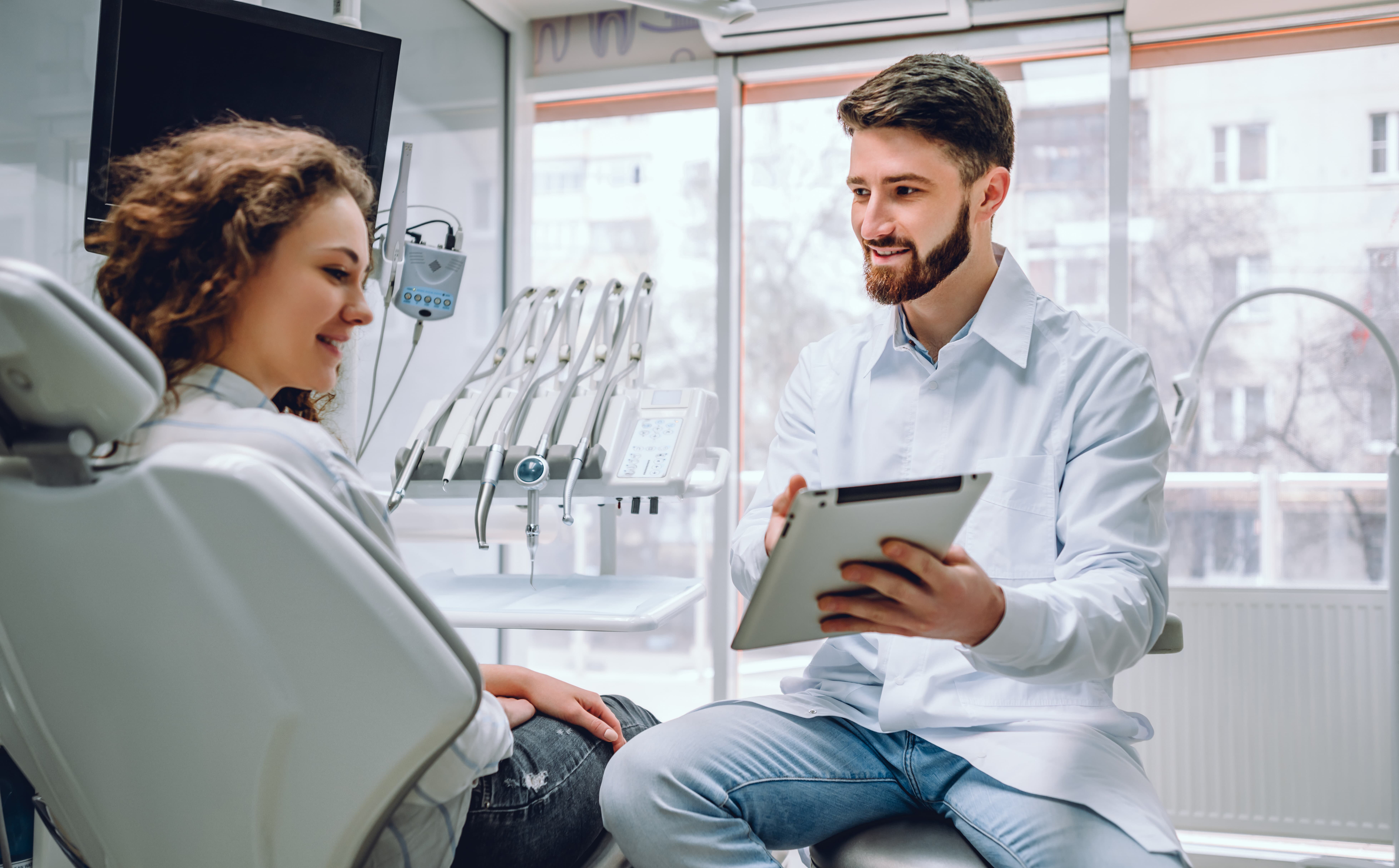 dentist showing oral cancer treatment options